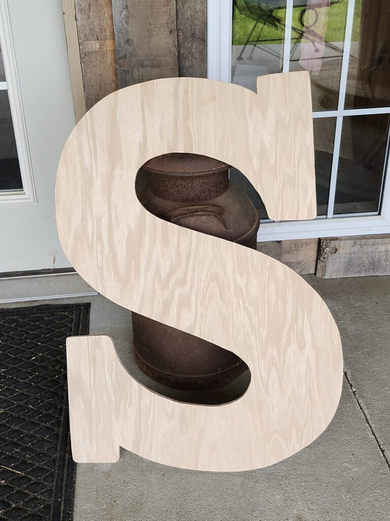 Custom wooden initial guestbook built by venue owner husband for rustic wedding