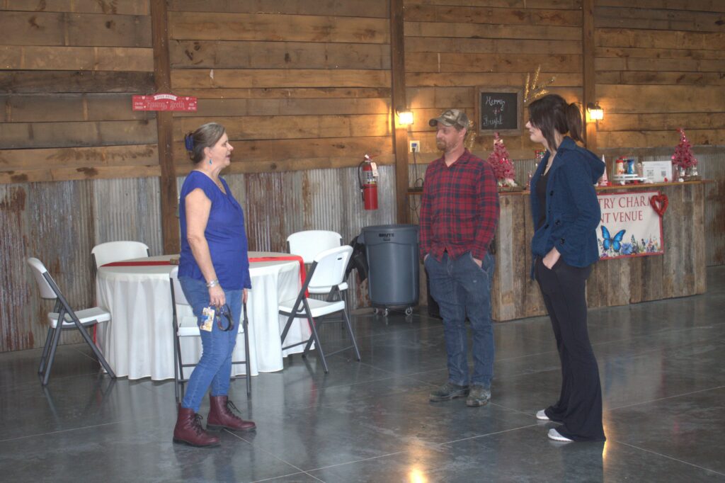 Couple touring the reception space at Country Charm Venue in Neosho, MO.