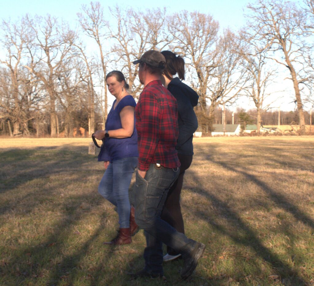 Couple touring the outdoor ceremony space at Country Charm