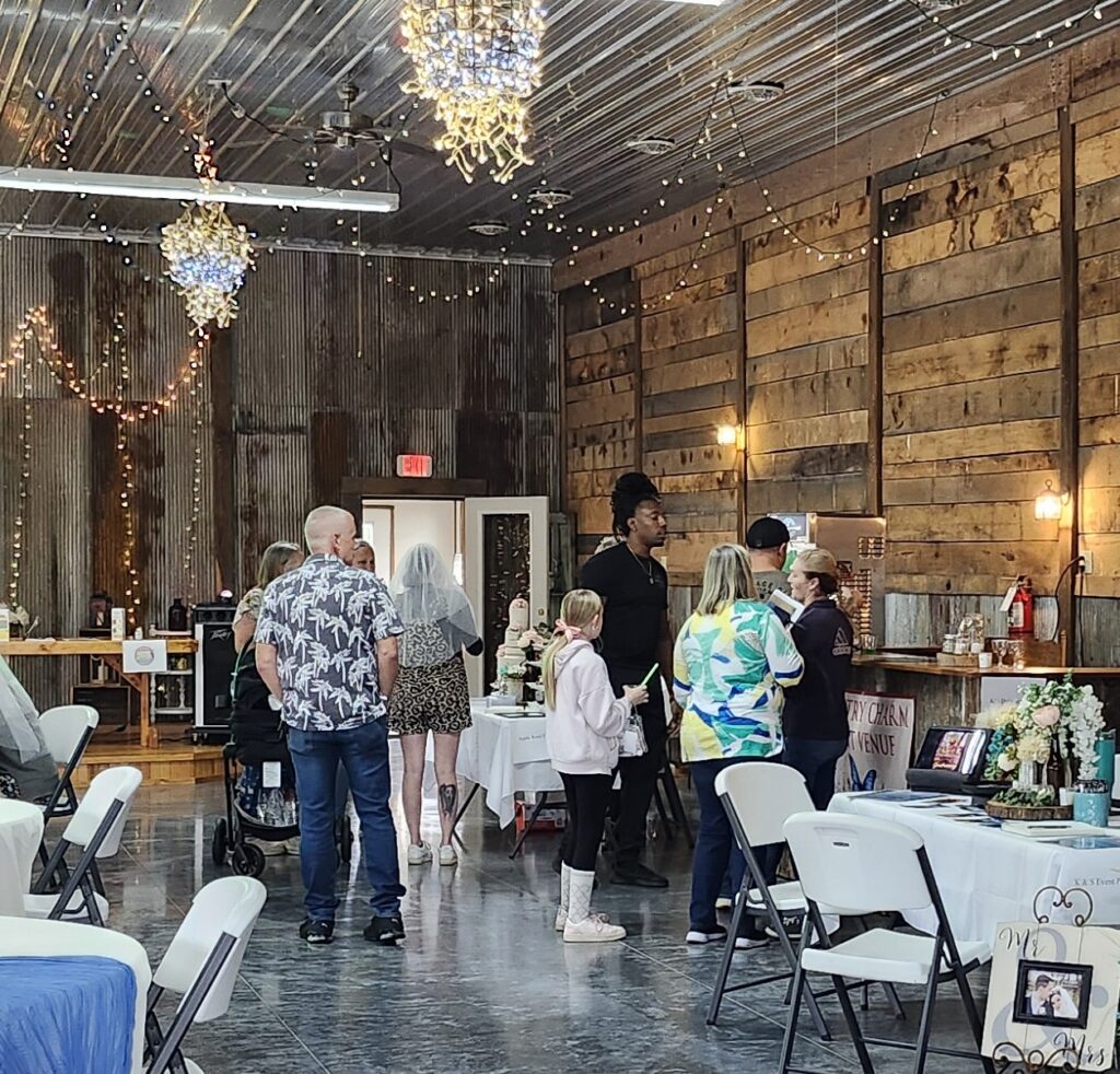 Vendors and engaged couples meet at Country Charm Bridal Expo 2025.